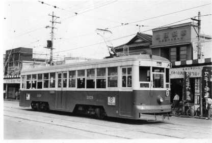 old tram stopping in the street 1475x1001